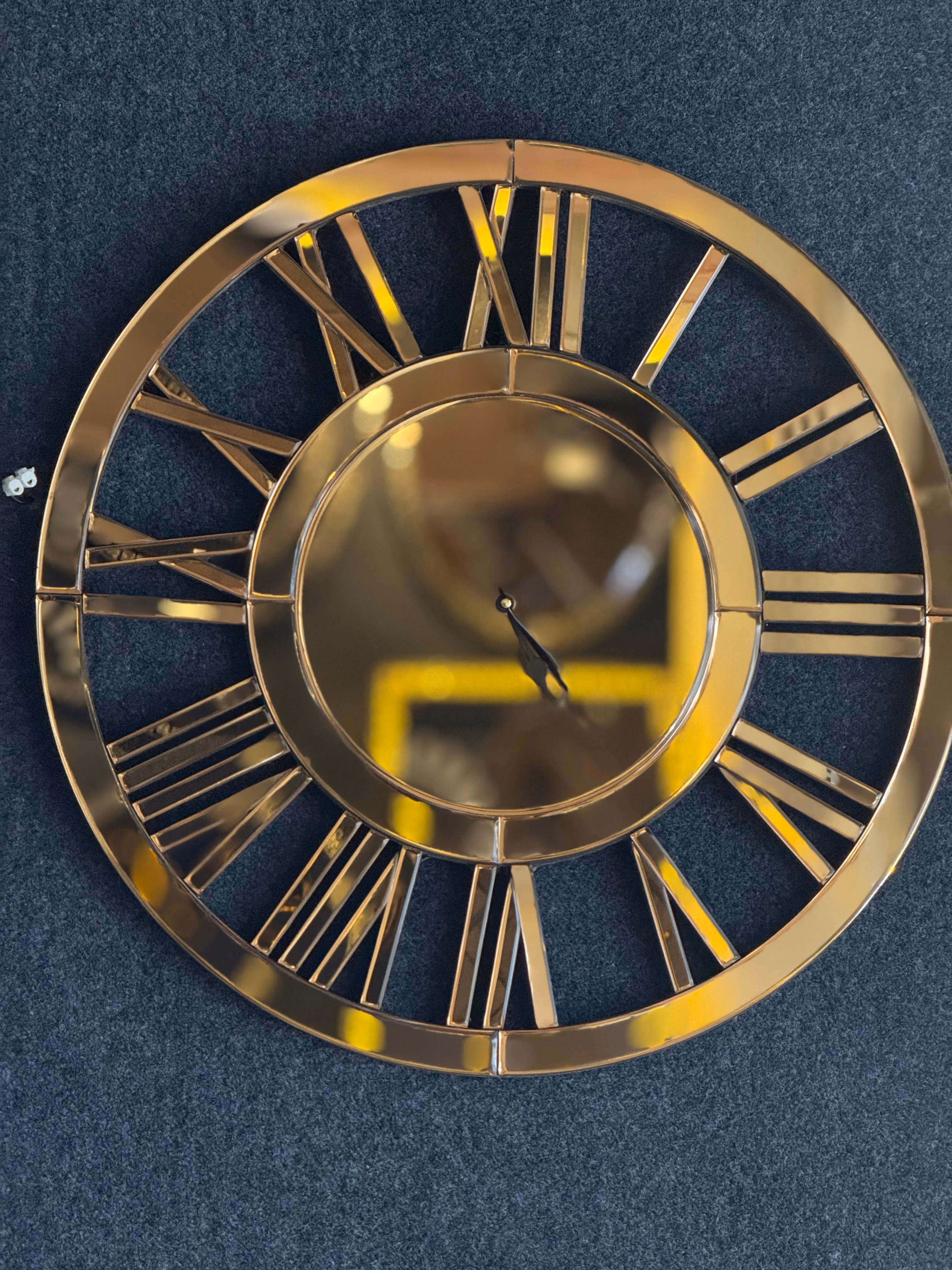 Gold mirrored skeleton wall clock handmade by GlassWorld Kerala