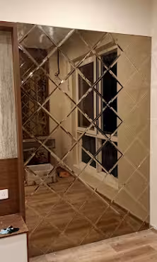 Bronze diamond bevelled mirror wall panel installed in a Kochi home